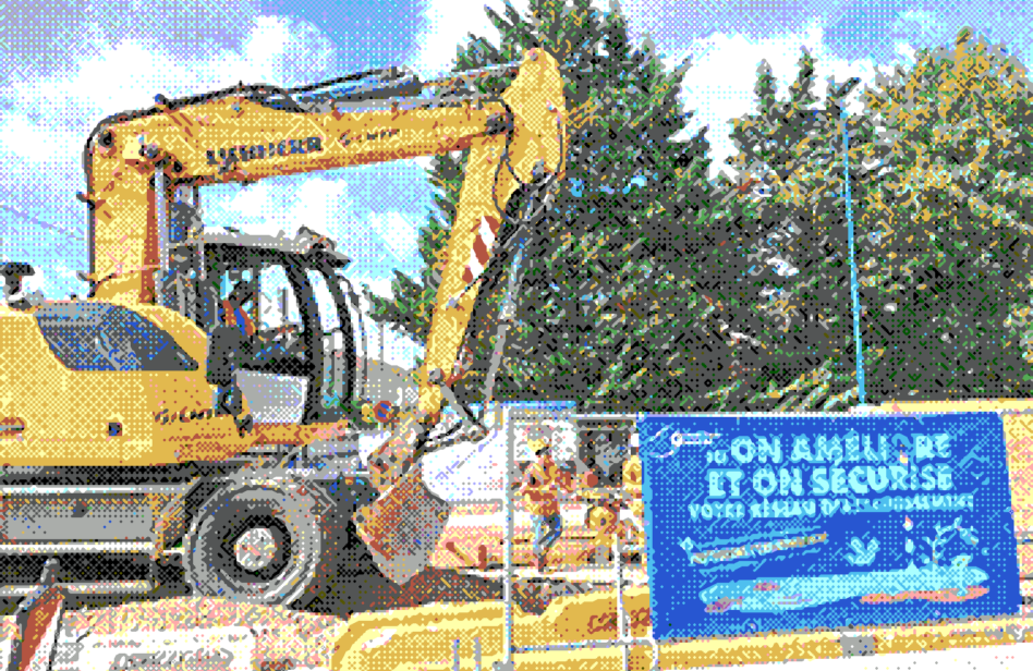 Pelleteuse réalisant des travaux d'assainissement